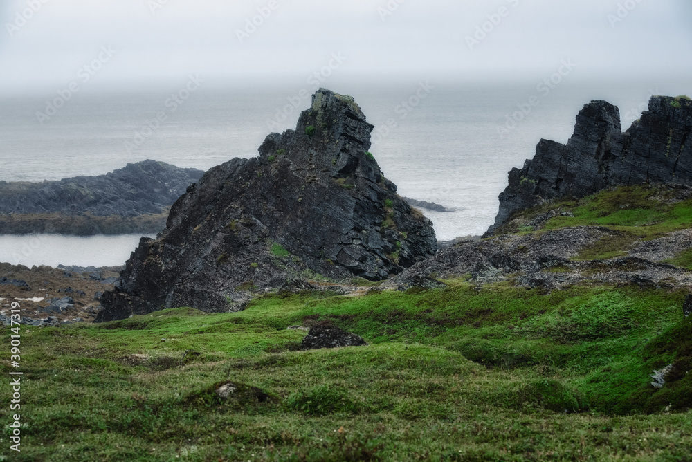 Northern landscapes of Cape Kekursky on the Sredny peninsula in cloudy weather. Kola Peninsula. Murmansk region, Russia Northern landscapes of Cape Kekursky on the Sredny peninsula in cloudy weather. Kola Peninsula. Murmansk region, Russia