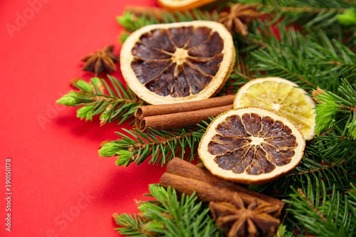 Fototapeta Naklejka Na Ścianę i Meble -  Composition with christmas tree branches, dry orange slices, cinnamon and anise spices