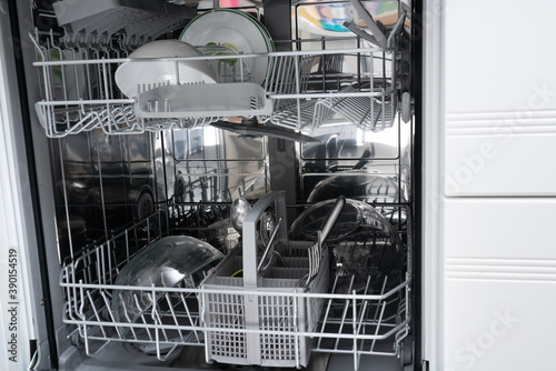 Loaded dishwashing as timesaving house appliance concept