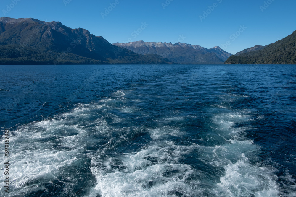 waves of a boat in a lake in Patagonia Argentina
