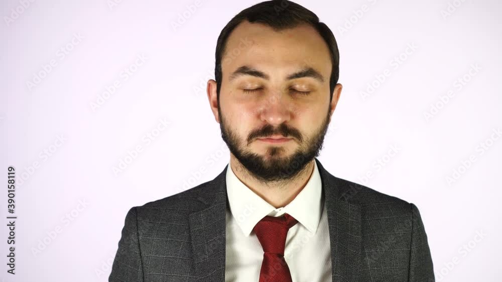Handsome man calming down with meditation. Businessman with closed eyes Handsome man calming down with meditation. Businessman with closed eyes