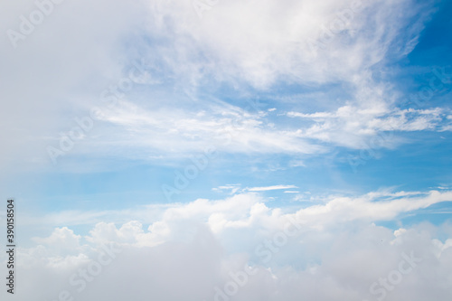 Fototapeta Naklejka Na Ścianę i Meble -  White fluffy cloud on blue sky background.