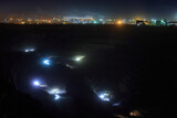 The process of mining iron ore in the pit at night
