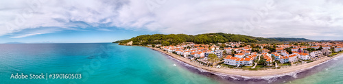 Aerial drone view of Fourka Skala sea and pine forest in Halkidiki, Greece photo