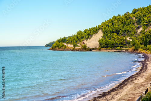 Blue sea and beach with forest in Fourka Scala, Halkidiki, Greece