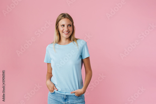 Cheerful beautiful girl smiling while posing at camera