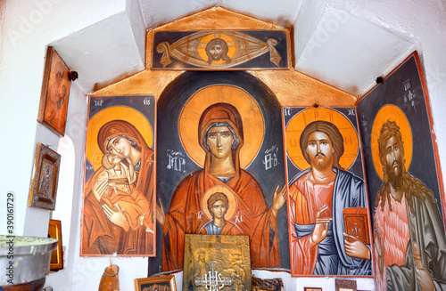 Traditional small church interior with religion paintings in Greece