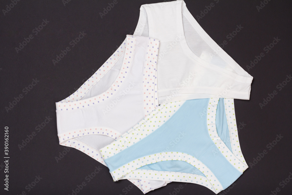 Beautiful women's cotton panties on black background. Beautiful women's cotton panties on black background.