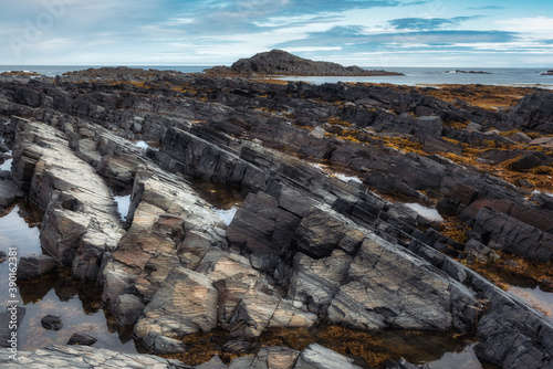 The rocks of Cape Kekursky on the Rybachy peninsula. Russia, Murmansk region photo