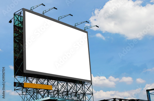 blank canvas billboard white screen design for display advertising banner outdoor. large mockup ad banner with blue sky and cloud. photo