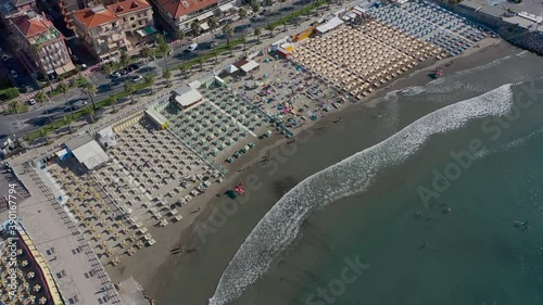 drone descending over a beach in Andora, Liguria photo