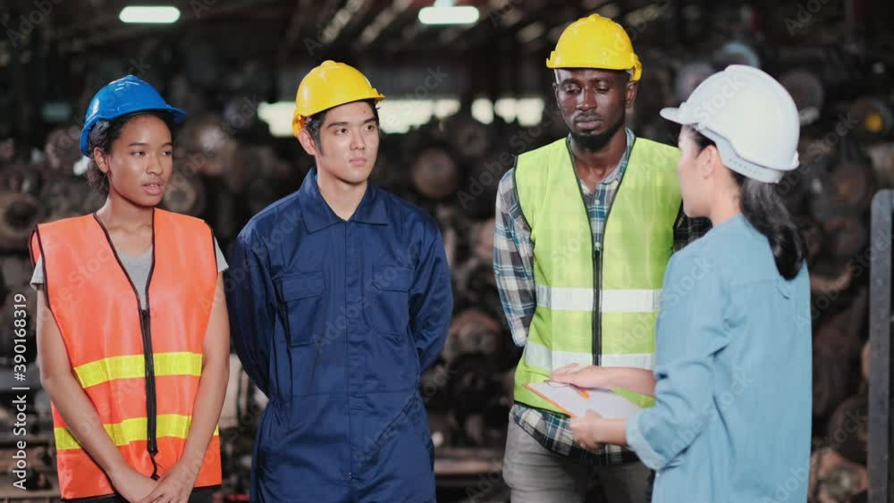 Manager woman remind the factory workers teams on implementation of the procedure in the automotive parts workplace area. Staff in not happy and bored. Improvement and management concept.