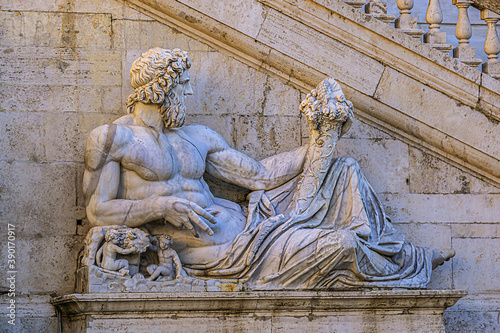 Palazzo Senatorio ("Senatorial Palace") in Square Campidoglio (Piazza del Campidoglio) on Capitoline Hill. Fountain near staircase features river gods of Tiber, Nile, Dea Roma (Minerva). Rome, Italy.
