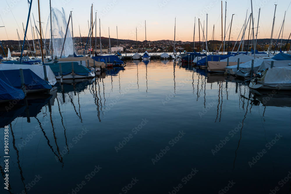 Sailboats parked in a pier on lake Zurich Switzerland late evening blue hour