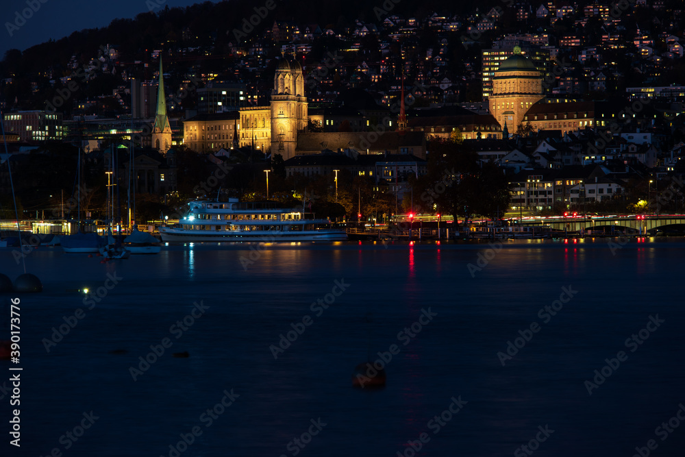 Fototapeta premium Zurich city Switzerland late evening blue hour hills in the background lake side view