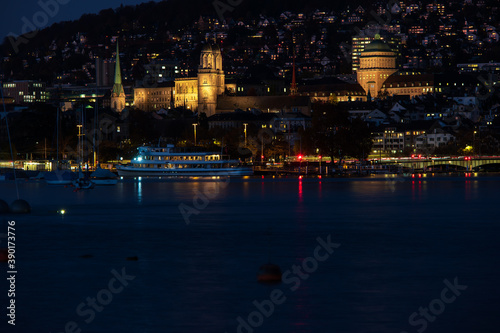 Zurich city Switzerland late evening blue hour hills in the background lake side view