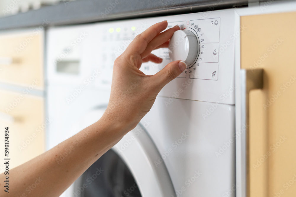 Modern washing machine equipment stands at home