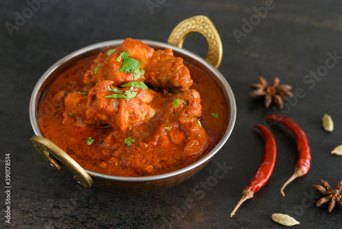 Spicy red chicken curry. Goan style chicken vindaloo. Butter chicken Murgh Makhani curry roast hot and spicy gravy dish Dhaba Punjab, India. North Indian non-vegetarian cuisine Garam Masala. tikka photo