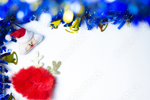 White background and bokeh features Santa Claus and Reindeer dolls for the Holiday and Christmas season to greet the branches with copy space for text.