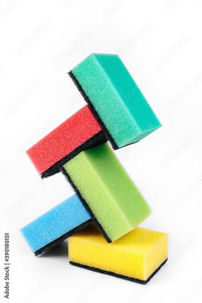 Photo of colorful dishwashing sponge stack on white background. Photo of colorful dishwashing sponge stack on white background.