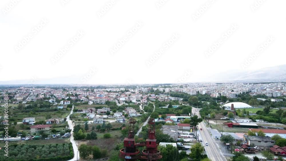 Aerial drone 4k clip moving forward next to a chimney and an industrial area in the area of Drama in Northern Greece Aerial drone 4k clip moving forward next to a chimney and an industrial area in the area of Drama in Northern Greece