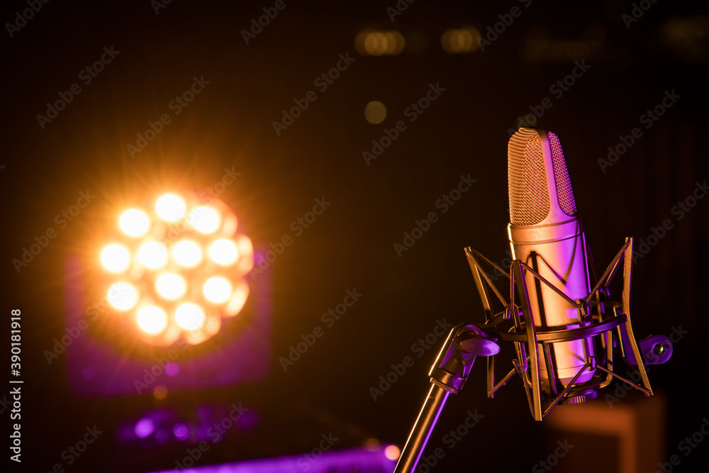 microphone with blurred night light background and soft focus. Stock Photo  | Adobe Stock