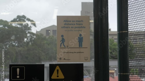 Social Distancing Sign On Glass Window - Redfern Train Station - Sydney, NSW, Australia.  - clsoe up shot photo