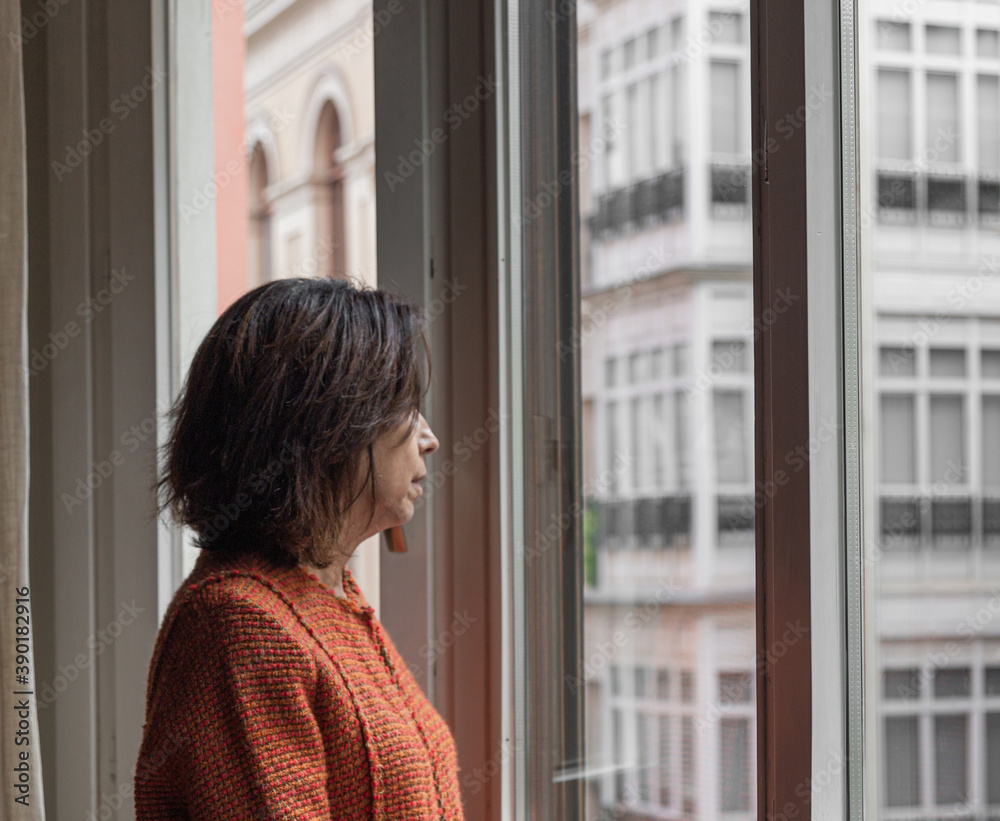 Female looking out of window