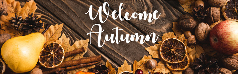 Top view of harvest and foliage near welcome autumn on wooden background, panoramic shot