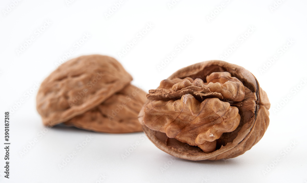 Walnuts in close-up, isolated on a white background.Space for text Walnuts in close-up, isolated on a white background.Space for text