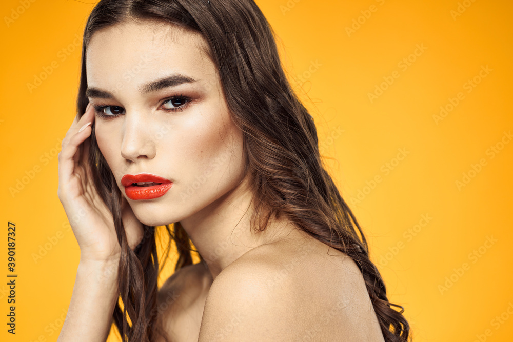 beautiful brunette red lips bare shoulders skin care yellow background beautiful brunette red lips bare shoulders skin care yellow background