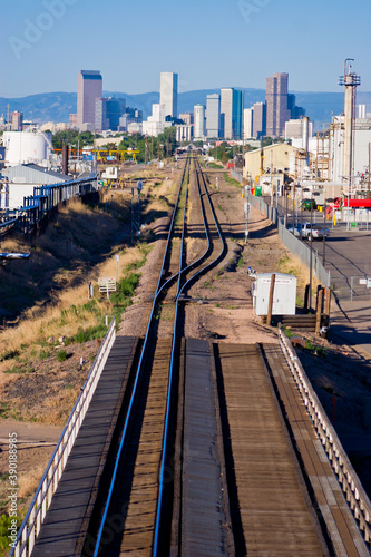 Downtown Tracks - Railroad tracks in industrial north Denver with the high rises in the Downtown Denver Skyline, Denver, Colorado photo