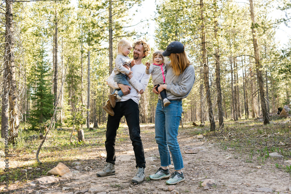 Parents with little daughters (2-3) standing on path in Uinta-Wasatch-Cache National Forest