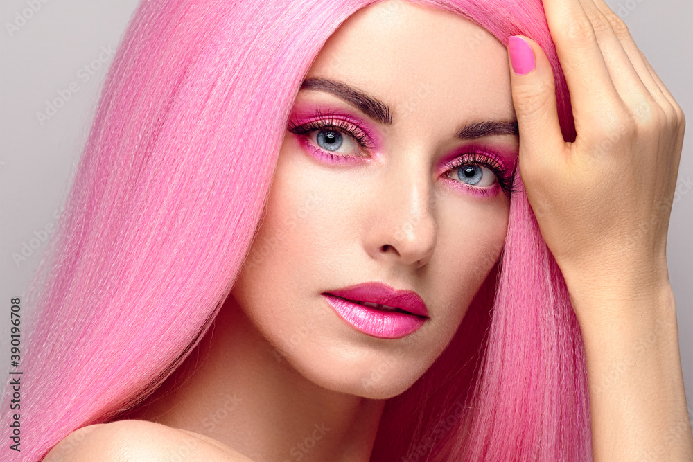 Beauty Fashion woman with Colorful Pink Dyed Hair. Girl with blue eyes, perfect Makeup and Hairstyle. Beautiful smiling model portrait, fashionable pink make up, hair. Skincare concept Beauty Fashion woman with Colorful Pink Dyed Hair. Girl with blue eyes, perfect Makeup and Hairstyle. Beautiful smiling model portrait, fashionable pink make up, hair. Skincare concept