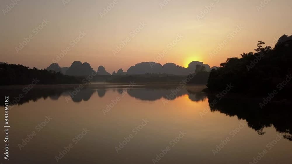Beautiful Reflection Of Hills And Islands In Nong Thale Lake Thailand In Sunrise - Moving wide shot Beautiful Reflection Of Hills And Islands In Nong Thale Lake Thailand In Sunrise - Moving wide shot