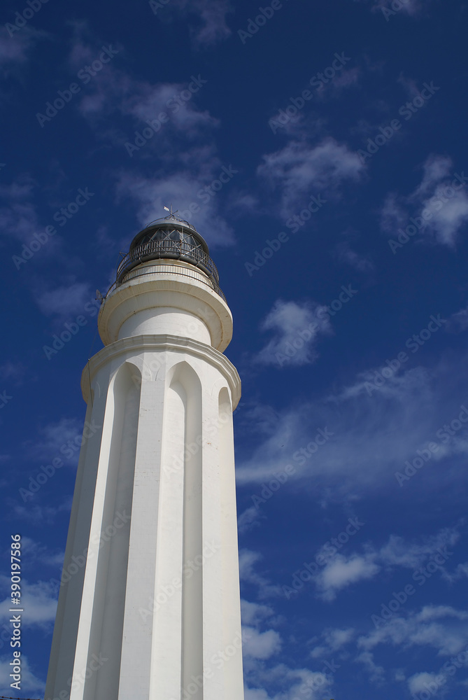 Trafalgar lighthouse over blue sky in Barbate, Cadiz. Spain