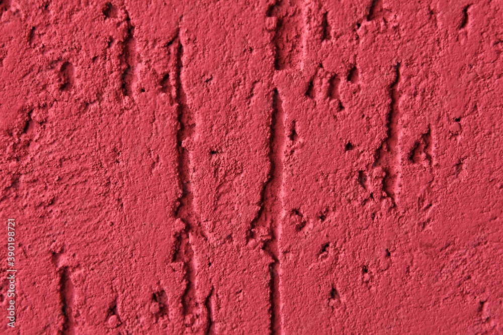 Fototapeta premium Red abstract backdrop with deep scratches. texture cement background. Painted surface with bark beetle effect. Concrete wall
