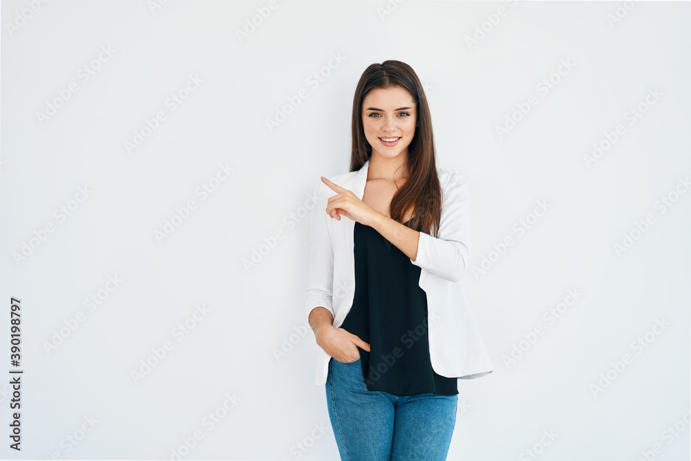 Pretty happy woman pointing her finger showing empty copy space isolated on white background Pretty happy woman pointing her finger showing empty copy space isolated on white background
