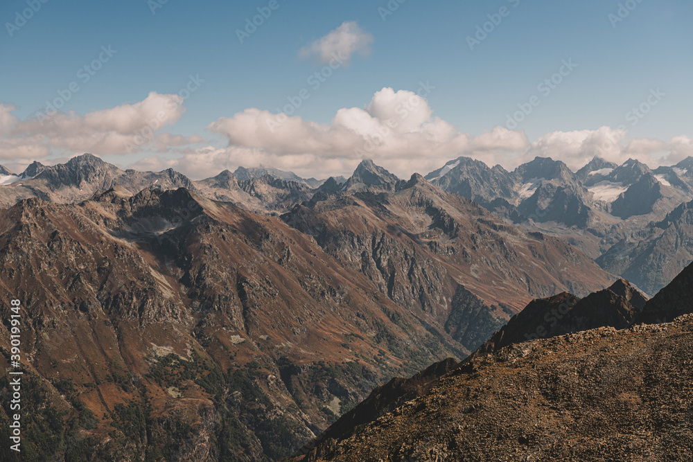 Panoramic view of mountain peaks. Summer in mountains. Hiking and ecotourism in mountain. 