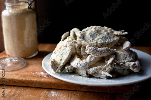 Close up of crabs with cornmeal coating on plate