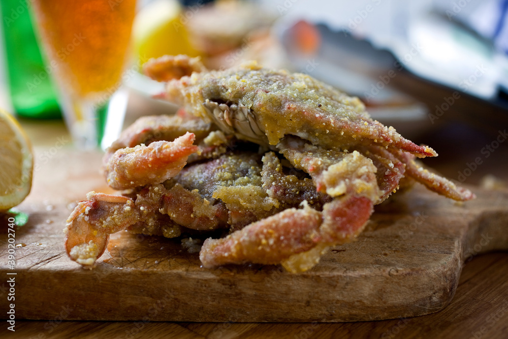 Close up of fried soft shell crabs served on cutting board Close up of fried soft shell crabs served on cutting board