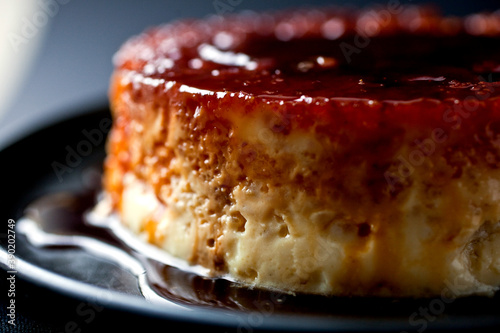 Close up of caramel rice flan served on plate photo