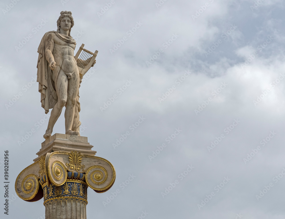 Apollo statue the ancient Greek god under cloudy sky, space for text Apollo statue the ancient Greek god under cloudy sky, space for text
