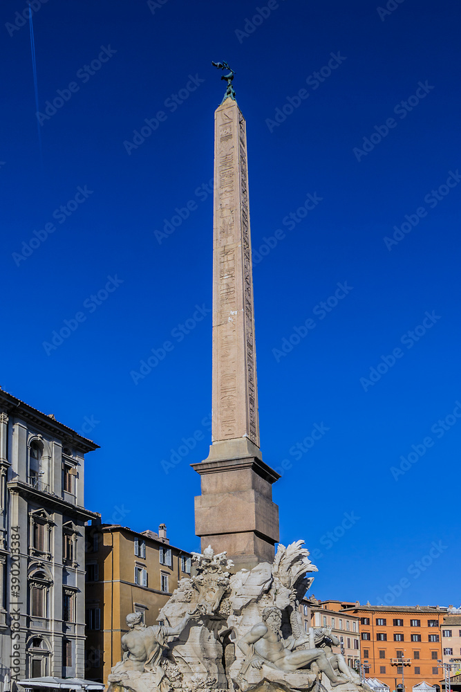 Fountain of the Four Rivers (Fontana dei Quattro Fiumi, by Gian Lorenzo Bernini, 1651) with Egyptian obelisk, in the middle of Piazza Navona. Rome, Italy.