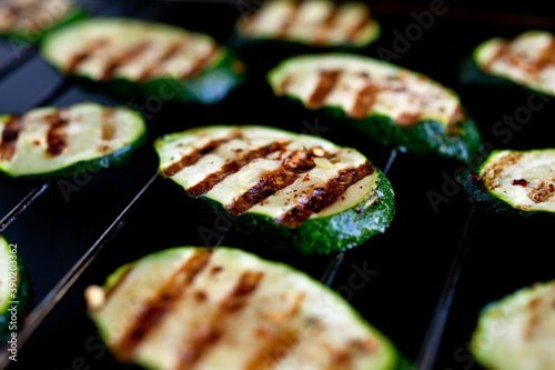 Close up of spicy grilled zucchini on cooling rack photo