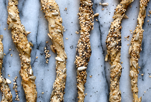 Overhead view of seeded semolina and rice flour bradsticks photo