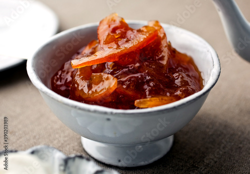 Close up of meyer lemon blood orange marmalade served in bowl