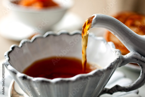 Close up of tea pouring in tea cup