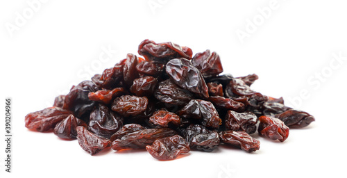 Heap of raisins on a white background. Isolated photo