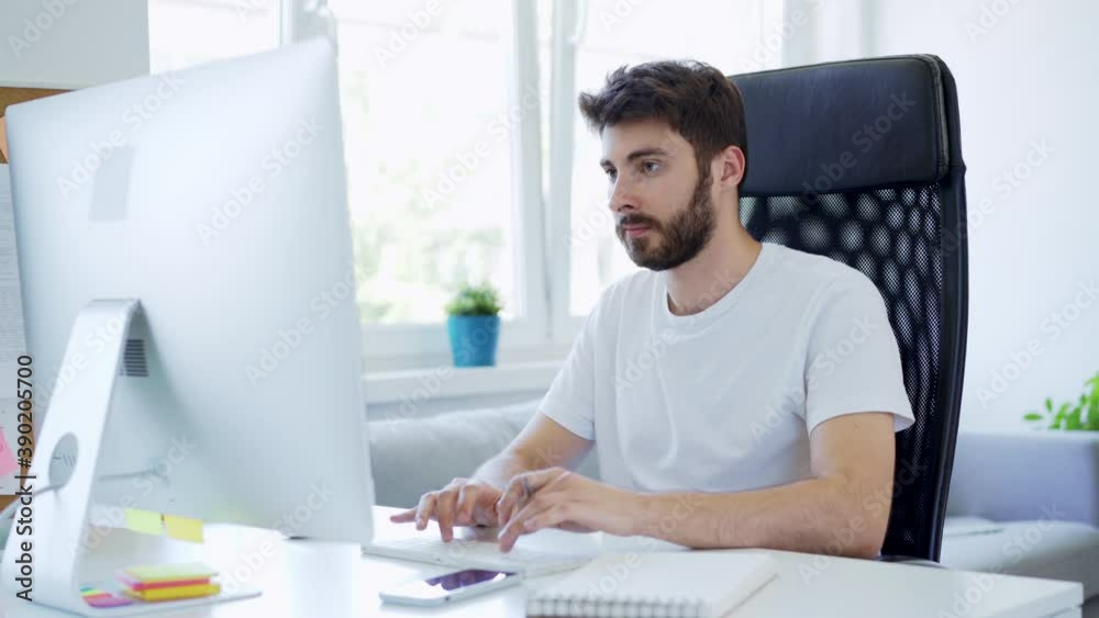 Young freelancer working from home with computer Young freelancer working from home with computer